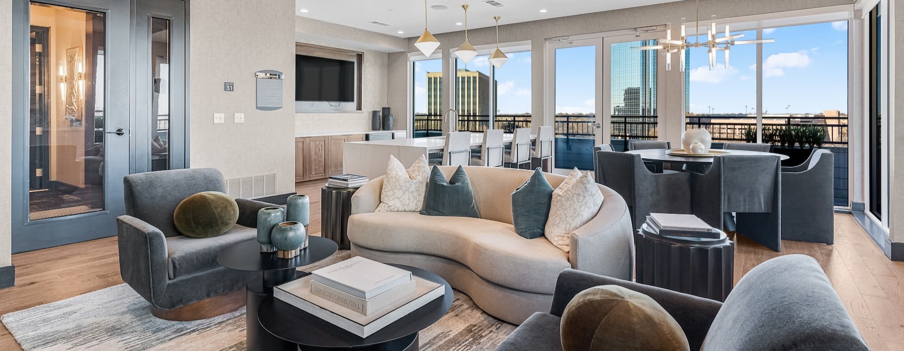 a clubroom with couches, tables and chairs