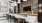 a clubroom kitchen with an island and chairs
