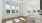 an empty living room area with wood floors and windows