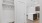 a kitchen with wood cabinets and a coat rack entrance area