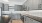 a kitchen with grey cabinets