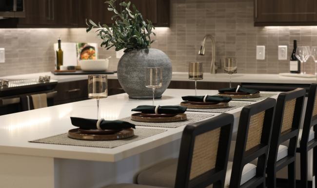 a kitchen with a table and chairs