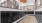 a mail room with black mail boxes
