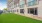a building with a green lawn
